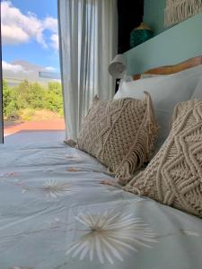 a bedroom with a bed with a view of the ocean at PicoTerrace in Madalena