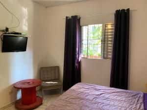 Cama ou camas em um quarto em Villa Paraíso