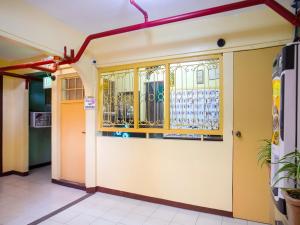 a building with a door with a stained glass window at OYO 802 Ka Farah's Inn in Antipolo