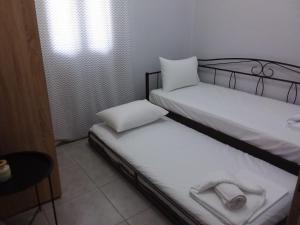 Postel nebo postele na pokoji v ubytování THALASSA ALMYROS APARTMENTS