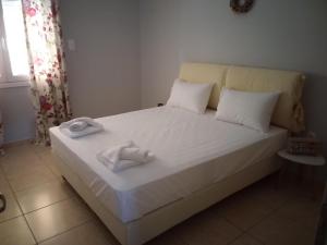 Postel nebo postele na pokoji v ubytování THALASSA ALMYROS APARTMENTS