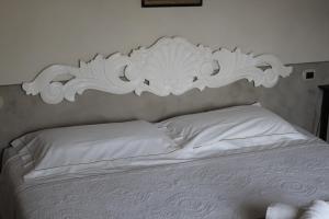 A bed or beds in a room at Agriturismo Mancassola