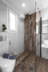 a bathroom with a shower and a toilet and a sink at "HoMes" I, The aRt BoutiQue experience by Lou Lenny in Kallithea Halkidikis +11 photos