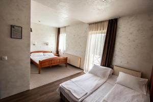 Uma cama ou camas num quarto em Hotel Enigma