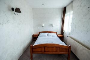 Uma cama ou camas num quarto em Hotel Enigma