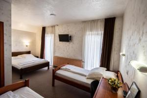 Uma cama ou camas num quarto em Hotel Enigma