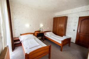 Uma cama ou camas num quarto em Hotel Enigma