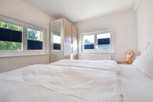 Ein Bett oder Betten in einem Zimmer der Unterkunft Usedom To Hus