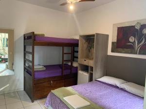 Cama ou camas em um quarto em Villa Paraíso