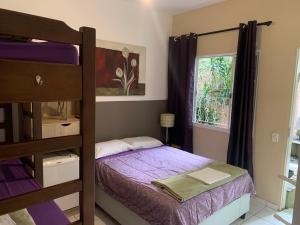 Cama ou camas em um quarto em Villa Paraíso