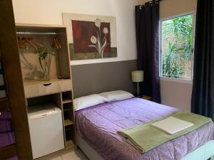 Cama ou camas em um quarto em Villa Paraíso