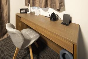 a desk with a chair and a laptop on it at Coruscant Hotel NagasakiekiⅢ in Nagasaki +52 photos