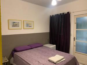 Cama ou camas em um quarto em Villa Paraíso