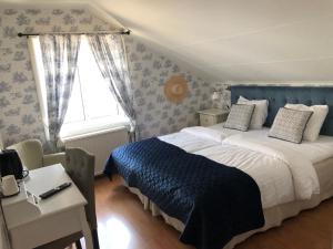 Katil atau katil-katil dalam bilik di Nautic Hotell