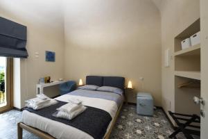 Säng eller sängar i ett rum på La Cascina di Chiara