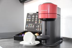 a red coffee maker sitting on top of a counter at Am Kronengarten in Hilden