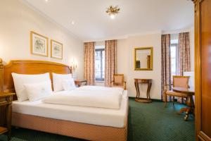 Postel nebo postele na pokoji v ubytování Hotel Bräu