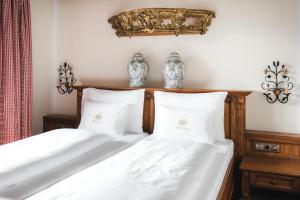 Postel nebo postele na pokoji v ubytování Hotel Bräu