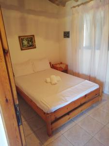 Postel nebo postele na pokoji v ubytování Kastraki Villas