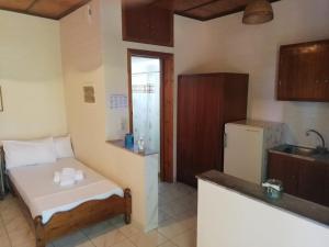 Postel nebo postele na pokoji v ubytování Kastraki Villas