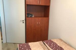 A bed or beds in a room at HUGO Lak Zamárdi