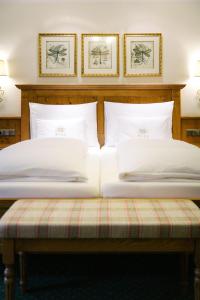 Postel nebo postele na pokoji v ubytování Hotel Bräu