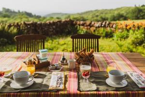 a wooden table with a table cloth with at La douce France in Collonges la rouge +16 photos