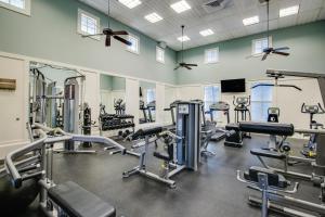 a gym with several treadmills and machines at Cinnamon Beach Resort in Palm Coast