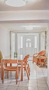 a dining room with a table and chairs at Apartments Lakeview in Liptovský Trnovec