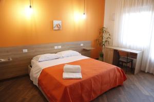 Postel nebo postele na pokoji v ubytování All’Anoneto B&B