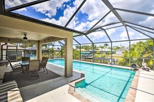 una imagen de una casa con piscina en Cape Coral Canalfront Home with Pool and Dock, en Cabo Coral