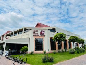 a building with a sign on the front of it at Cruce de Gustos in Ivano-Frankivsʼk