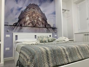 Llit o llits en una habitació de Suite del Ponte Normanno Vespro