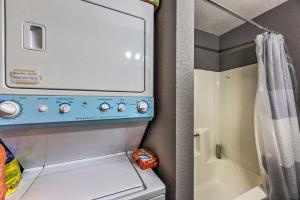 a small kitchen with a washer and dryer at Rustic Ruidoso Cabin with Large Deck and Grill! in Ruidoso +20 photos