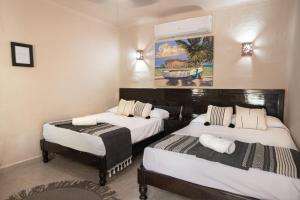 Postel nebo postele na pokoji v ubytování Hotel Macondo Holbox