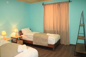 En eller flere senge i et værelse på Gnishik Eco Resort