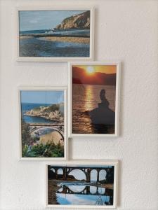 three pictures hanging on a wall at O Chaleco in San Ciprián