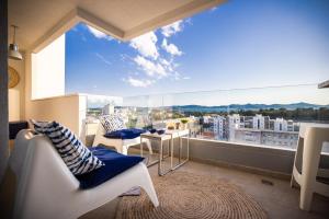 a room with a large window with a view of a city at Island View Luxury Apartments in Zadar