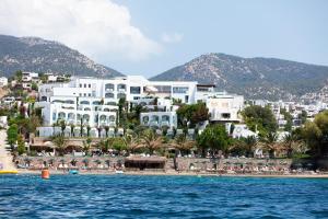 a view of a resort from the water at Royal Asarlik Beach Hotel in Gümbet