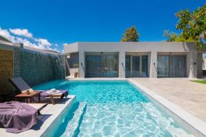 The swimming pool at or close to Rua Mat - Serene Villas with Modern Comfort, by ZanteWize