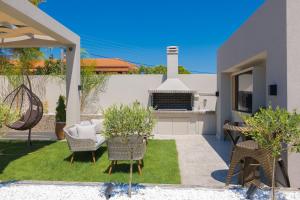A seating area at Rua Mat - Serene Villas with Modern Comfort, by ZanteWize