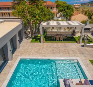 The swimming pool at or close to Rua Mat - Serene Villas with Modern Comfort, by ZanteWize