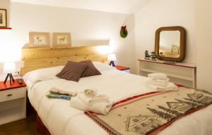 A bed or beds in a room at Aparthotel Claviere