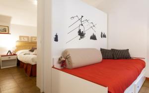 A bed or beds in a room at Aparthotel Claviere