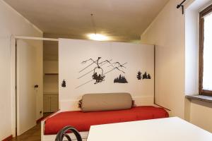 A bed or beds in a room at Aparthotel Claviere