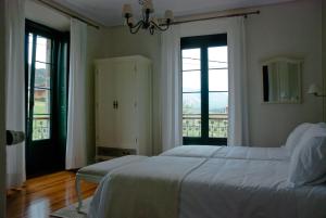 Postel nebo postele na pokoji v ubytování Hotel Rural La Raposera