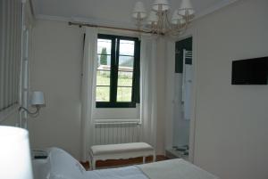Postel nebo postele na pokoji v ubytování Hotel Rural La Raposera