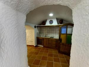 Kuchyň nebo kuchyňský kout v ubytování Cueva de Manuela + 4 fotografie