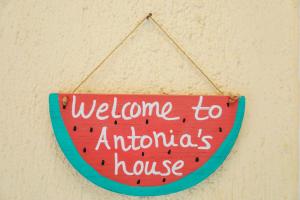 a sign that reads welcome to antichrists house at Antonia House in Skiathos Town