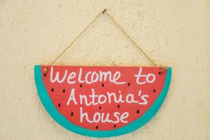 a sign that reads welcome to antichrists house at Antonia House in Skiathos